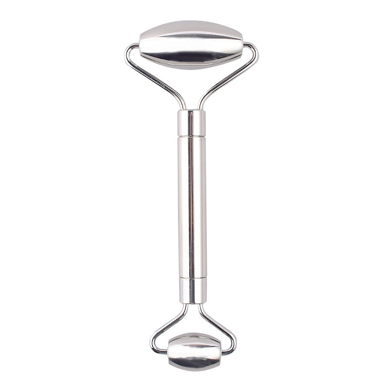 Double-ended stainless steel face roller on a white background