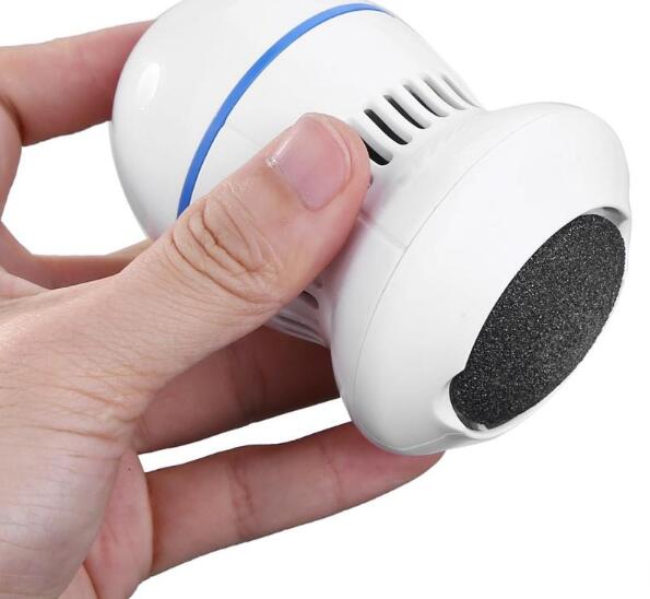Hand holding the electric callus remover, showing the roller head