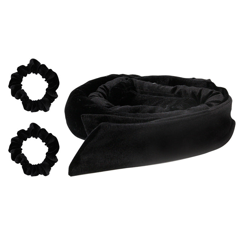 Glowly black velvet heatless curling rod with 2 matching scrunchies on a white background