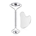 Glowly stainless-steel face roller and heart-shaped gua sha on a white background